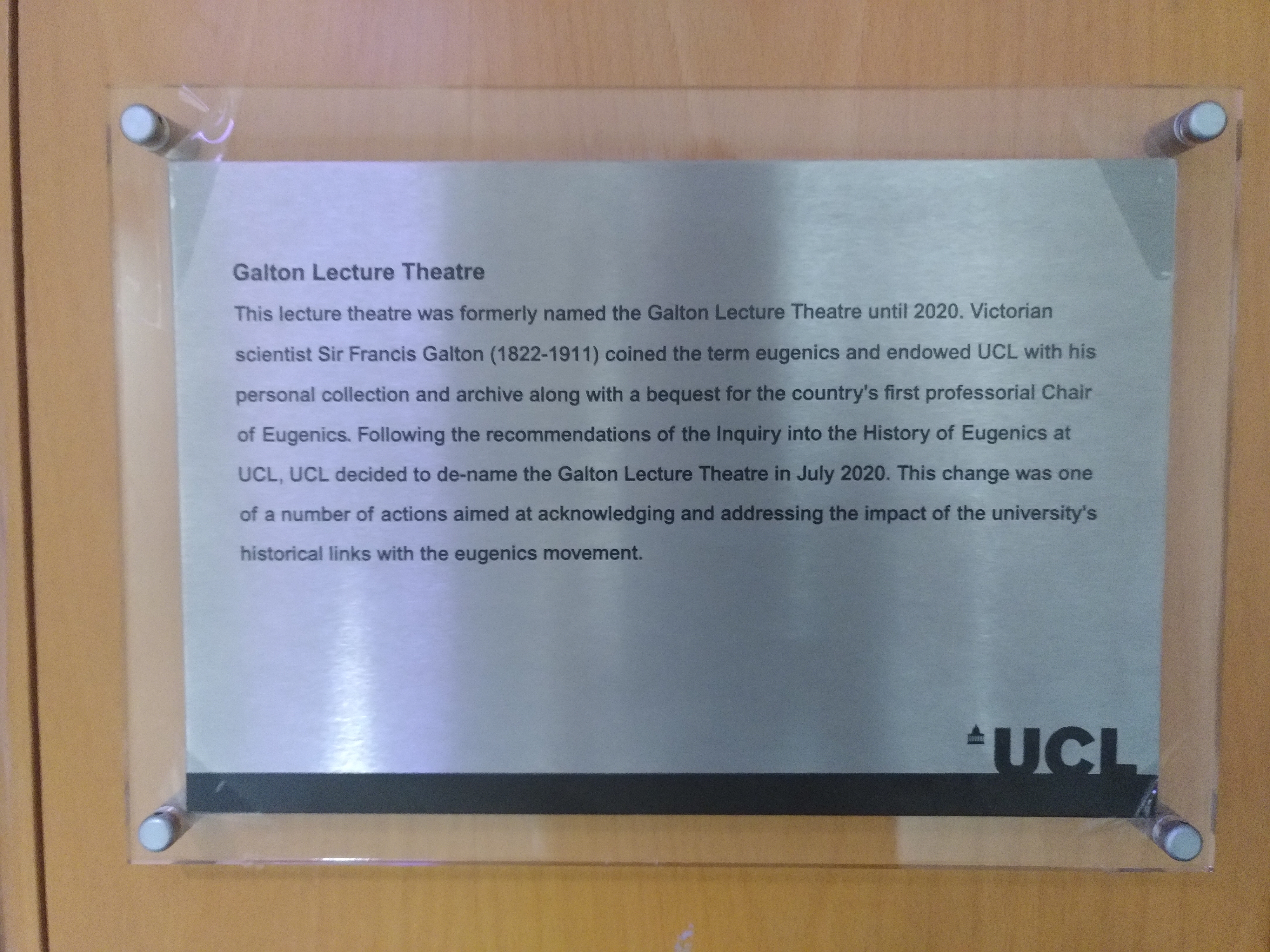 The figure on the right reads Lecture Theatre 115. The figure on the left reads Galton Lecture Theatre. This lecture theatre was formerly named the Galton Lecture Theatre until 2020. Victorian scientist Sir Francis Galton (1822-1911) coined the term eugenics and endowed UCL with his personal collection and archive along with a bequest for the country's first professorial Chair and Eugenics. Following the recommendations of the inquiry into the History of Eugenics at UCL, UCL decided to de-name the Galton Lecture Theatre in July 2020. This change was a number of actions aimed at acknowledging and addressing the impact of the university's historical links with the eugenics movement.